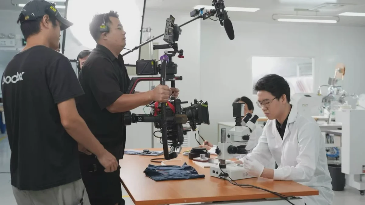 Behind the scenes of the undun brand film: camera crew filming a microscope scene